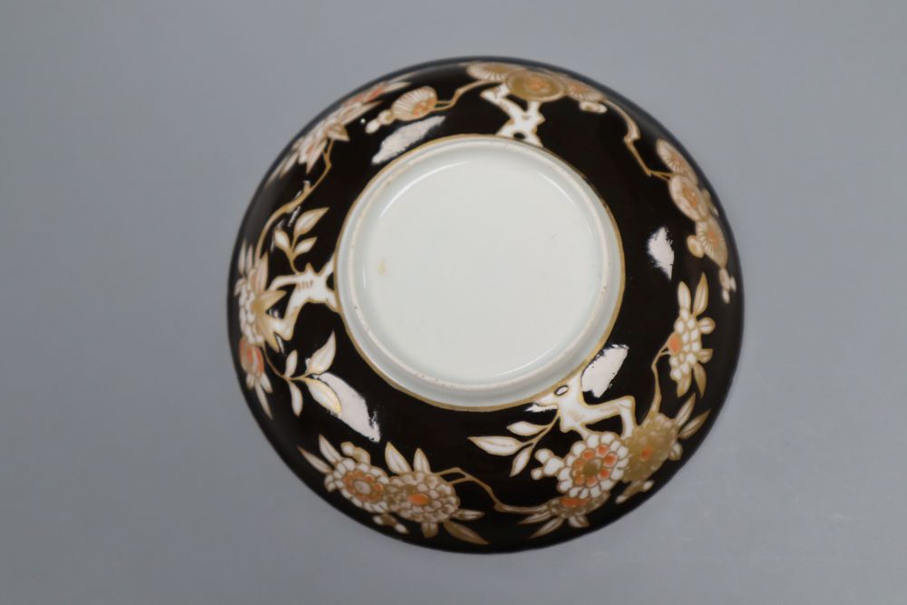 An Arita Dutch decorated saucer, 17th century, a Chinese Dehua Dutch decorated wine cup and a Nanking cargo stem cup